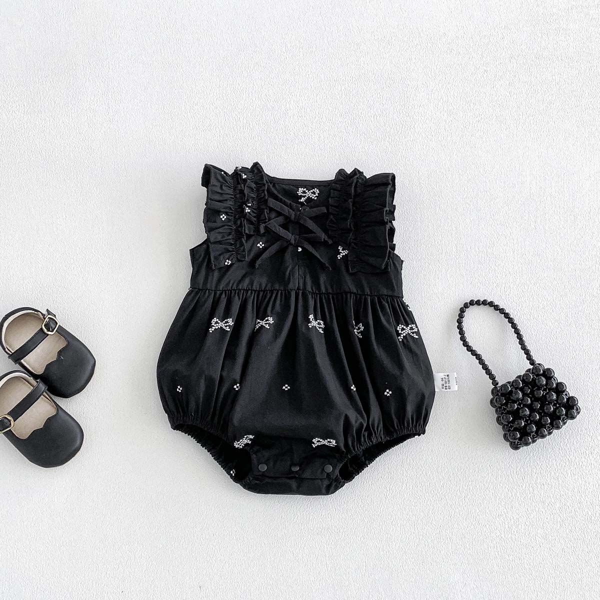 Macacão Preto com Estampa de L - Baby Clothing Online avaliação e preço